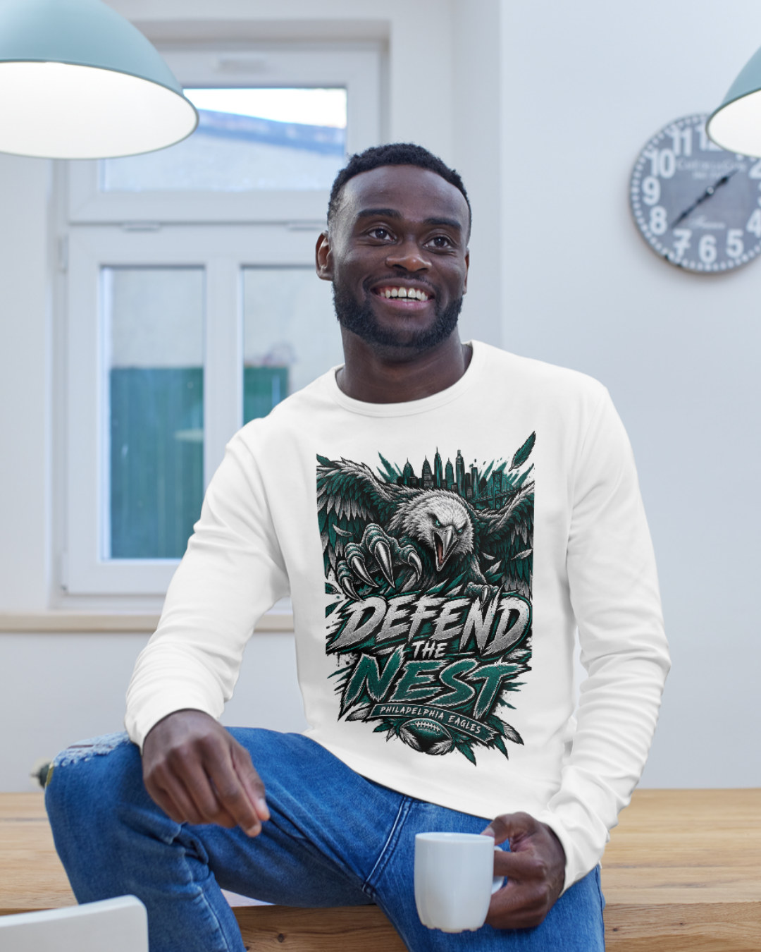 Man wearing an Eagles Defend the Nest sweatshirt